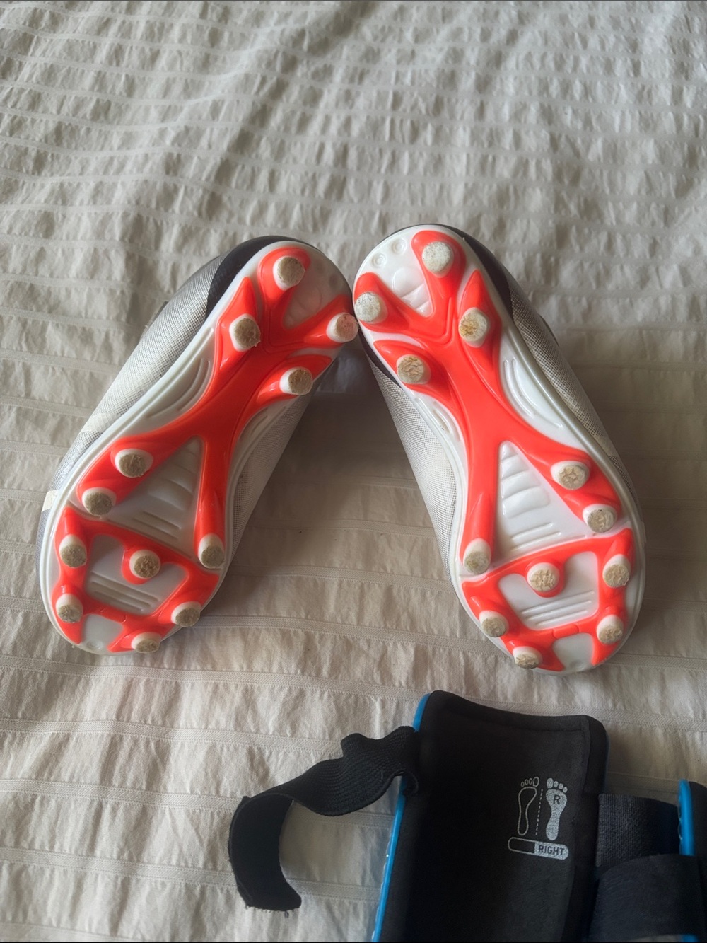 Toddler Kids Soccer Cleats in White and Gray with Blue Adidas Shinguards - Picture 4 of 10